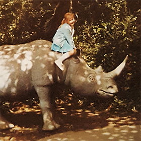 Michelle with a rhino when little