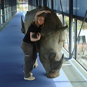 Michelle with a rhino in Amsterdam